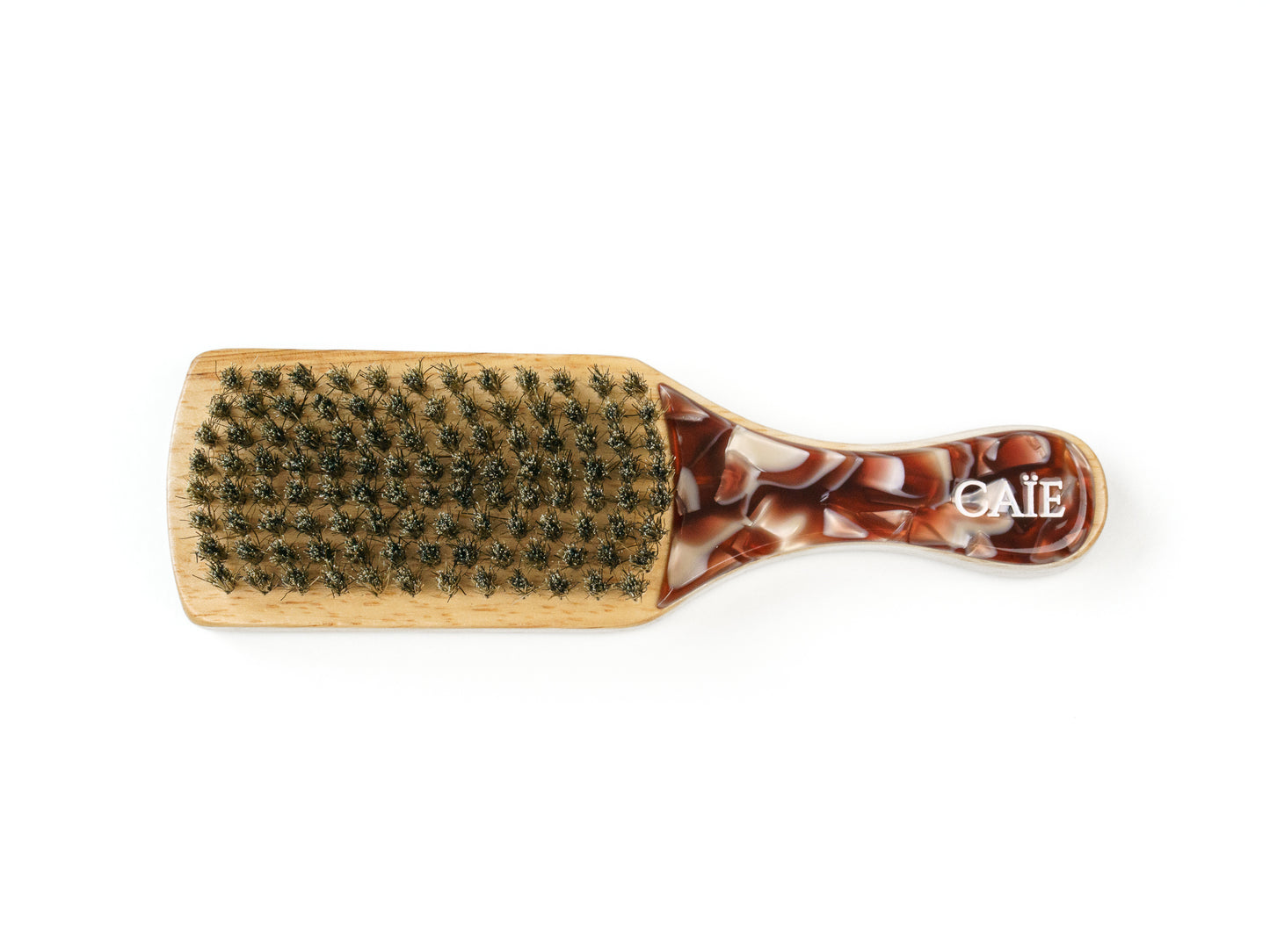 Close-up of high-quality natural boar bristles on CAÏE hairbrush